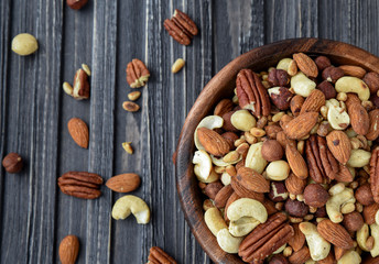 Nuts mix in a wooden plate