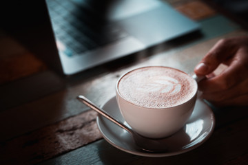 Hot black coffee on a natural background blurred Style dark tone