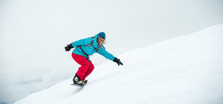 Young Woman On The Snowboard