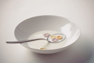 a bowl of milk on a white background. leftovers after breakfast
