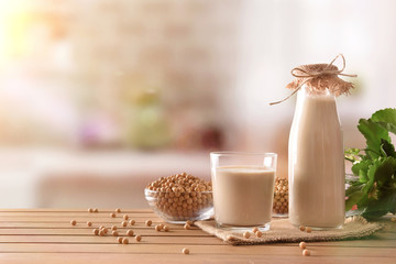 Reptientes with soy milk and grains in rustic kitchen background
