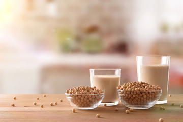 Reptientes with soy milk and grains in rustic kitchen front