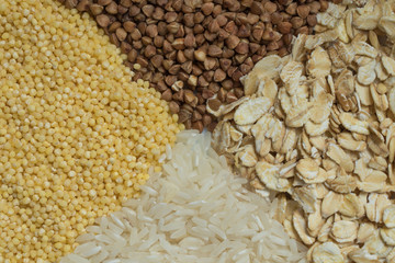 Grain cereals flares buckwheat, oats, millet, rice as background 