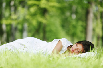 Woman sleeping on grass