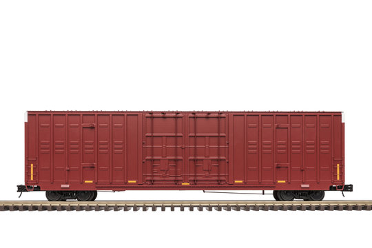 Railroad Box Car / A maroon railway box car on track.
