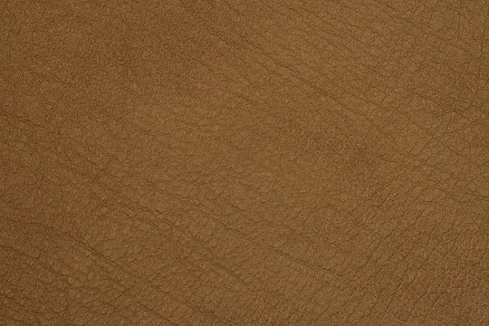 Light brown leather texture surface. Close-up of natural grain cow leather Light brown leather texture surface. Background