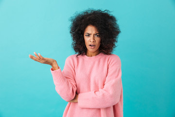Colorful image closeup of outraged woman with afro hairstyle throwing up hand and expressing...
