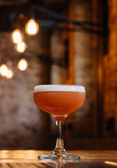 close-up view of conchita cocktail in glass on wooden table