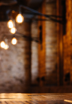 Empty Wooden Table And Blurred Restaurant Background