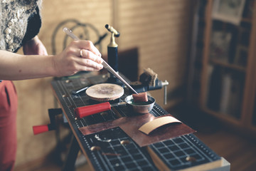 Home workshop girl master on gas burner boil water