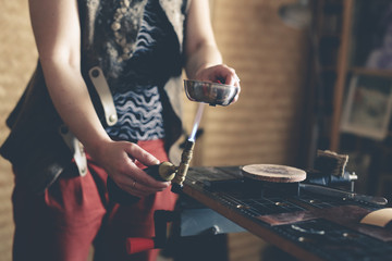 master craftsman near the bench works with tools