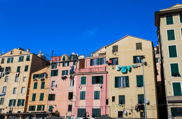 Fototapeta na wymiar Facade of colorful buildings in the historic center of Genoa, Italy.