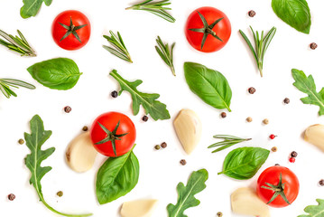 Tomato, garlic and basil isolated on white background, top view. Food pattern with fresh organic vegetables and spices. Flat lay.