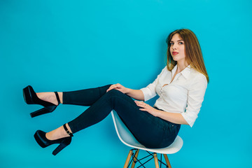 Fototapeta premium The model sits on a chair