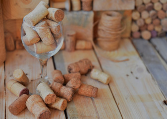 Close-up of wine corks lie in a glass and on a table. Art soft focus.