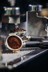 Barista roasting coffee beans grinder on coffee espresso machine