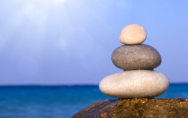 Spa stones balance on beach.