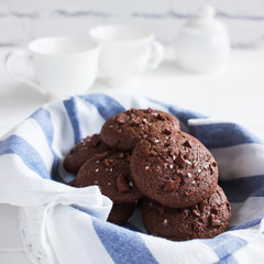 Chocolate cookies sea salt white wooden background.
