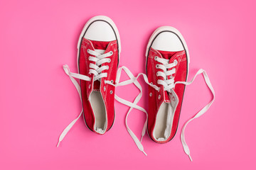 Vintage red shoes on pink background