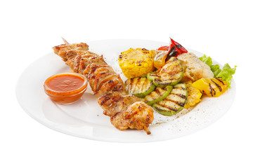 Shish kebab, beef, lamb, pork, chicken grilled meat, barbecue, with side dish vegetables on a plate, isolated on white background. Ketchup, tomato, red sauce. Side view For the menu