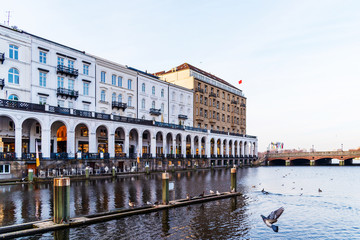 Naklejka premium historic buildings with arcade at Alster Lake in Hamburg, Germany on sunny day