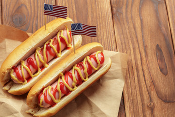 Hot dogs on wooden background
