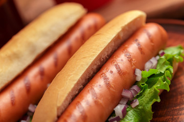 Hot dogs on wooden background