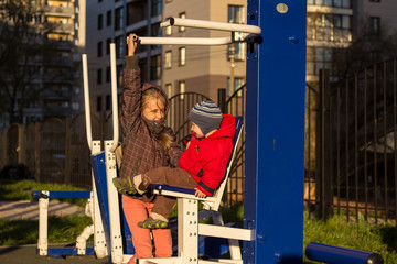 Fototapeta na wymiar children play in the playground on a spring day