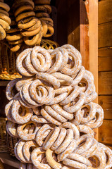 Sweets gingerbreads and bagels round form sprinkled with sugarfood fair on wooden background