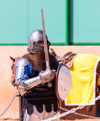 Knight - a participant in the knight festival stands on the list waiting for fight in Goren park in...