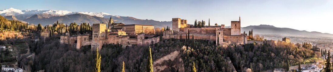 Palace and fortress complex Alhambra with Comares Tower, Palacios Nazaries and Palace of Charles V during sunset in Granada, Andalusia, Spain. - obrazy, fototapety, plakaty