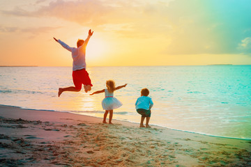 father with son and daughter enjoy beach vacation