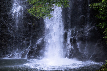 Water splashes into a pool at the Mino Waterfall in northern Osaka