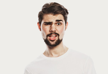 Obraz premium Portrait of young amazed man isolated on white background