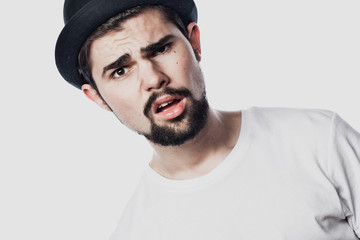Portrait of surprised bearded man  against white  background
