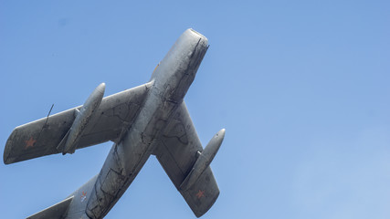 Old airplane on blue sky background