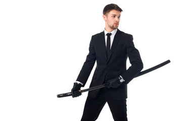 portrait of agent in suit and gloves with katana isolated on white