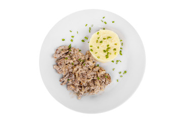 Frikasse from beef, pork, lamb meat with side dish mash potato, Green onions on a plate isolated white background. Juicy fillet, roast. For the menu bar, restaurant, cafe View from above