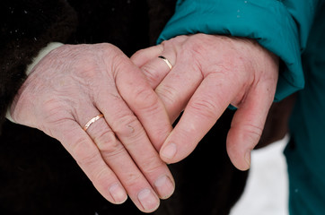hands of married couple at age