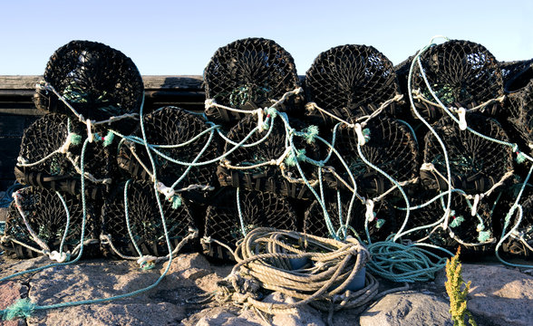Laesoe / Denmark: Crab fishing pots on the pier in the fishing port of Vesteroe Havn on Laesoe island