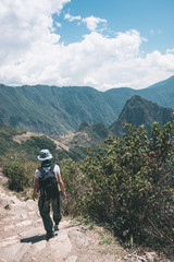 Fototapeta na wymiar Backpacker on Inca Trail, exploration of Machu Picchu, the most visited travel destination in Peru. Summer adventures in South America.