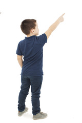   Back view of little boy points at wall. Rear view. Isolated on white background  © Jelena Ivanovic