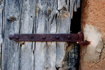 Old wood door with a rusty lock