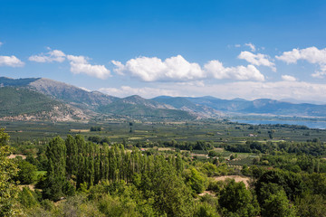 Fototapeta na wymiar Panoramic view from mountain on the Kastoria town and neighborhood Orestias lake. Greece