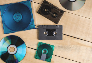 cassette disks floppy disks for music lie on a wooden table