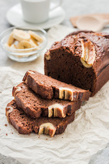 Double chocolate banana bread on light concrete background. Selective focus, space for text.