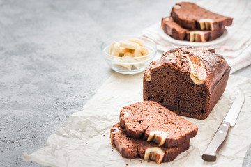 Cheesecake stuffed banana bread on light concrete background. Selective focus ,space for text.