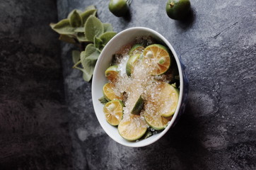 Healthy drink with fresh leaves, lemon, honey and sugar