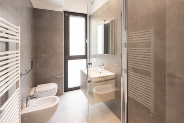 Naklejka na ściany i meble Minimalist modern bathroom with large tiles