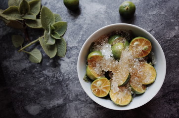 Healthy drink with fresh leaves, lemon, honey and sugar